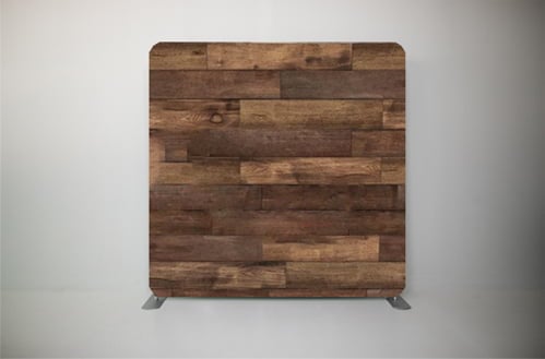 A wooden backdrop with wooden planks on it.