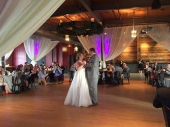 A bride and groom sharing their first dance at The Rickhouse wedding reception.