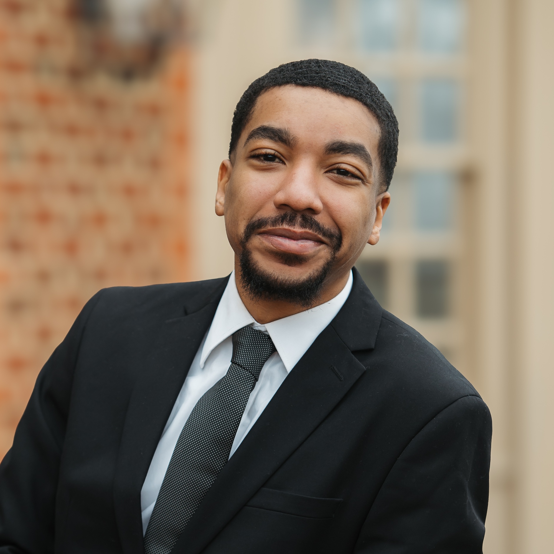 Landon 3 copy A black man in a suit and tie.