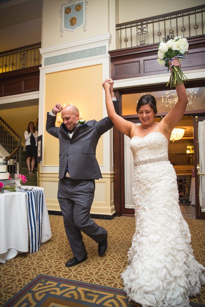 A bride and groom perform a lively Charleston dance at their wedding reception.
