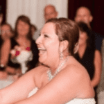 A bride and groom dance at their wedding reception.