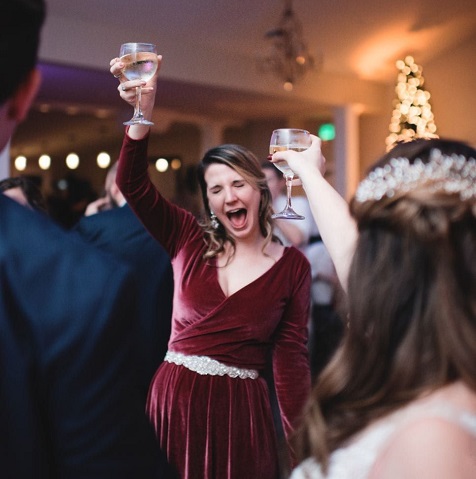 A bride and groom celebrating at a wedding reception.
