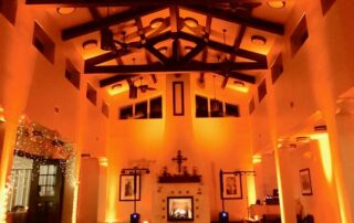 A large room lit up with orange lights.