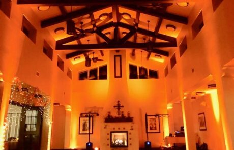 A large room lit up with orange lights.