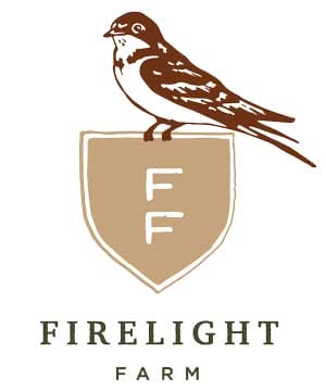 A bird sits on top of a tan shield with the letters “FF”; the text below reads “Firelight Farm.”.